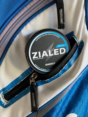 Fresh Mint Zialed can tucked into a blue and white bag