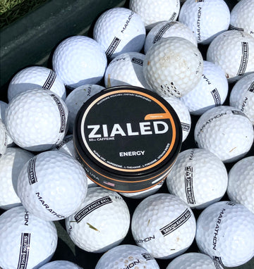 Zialed Tropical can resting among golf balls